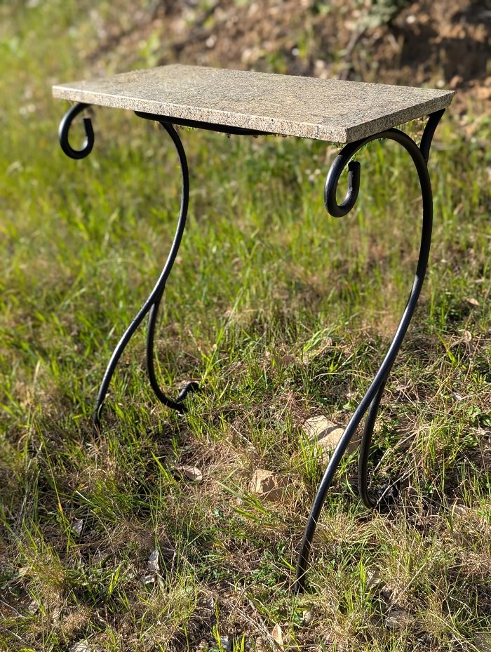 Granite topped scrolled steel table
